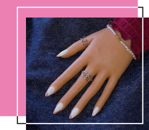 Brilliant white nails with gold waves.