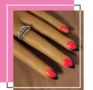 A Set of neon red nails with black tops