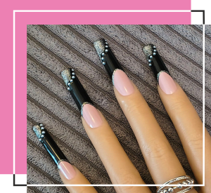 Nude base nails with an extra long black top
